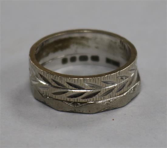 Two 18ct white gold wedding bands with engraved decoration.